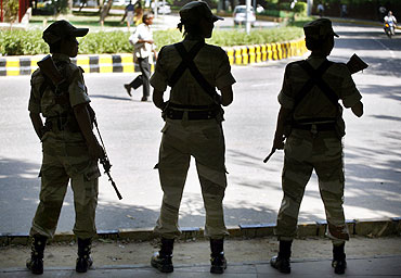 Security force personnel stand guard in New Delhi