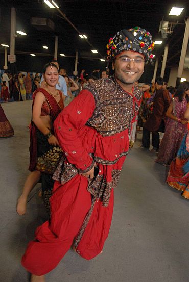 A couple in traditional attire takes part in the Navratri celebrations