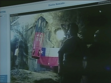 A frame grab shows Florencio Avalos, the first of 33 miners to be rescued, being hoisted out of the San Jose mine in Copiapo