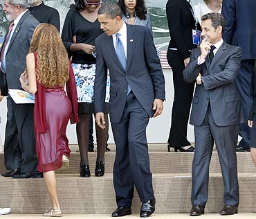 US President Barack Obama and France's President Nicolas Sarkozy with a junior G8 delegate