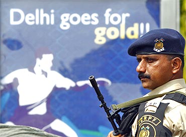 A Central Reserve Police Force personnel stands guard outside the Jawaharlal Nehru Stadium in New Delhi