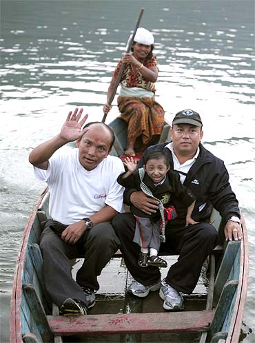Thapa takes a boat ride at Fewa Lake with his father Rup Bahadur Thapa (Left) and his mentor and the President of Khagendra Foundation Min Bahadur Thapa