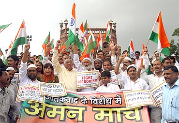 BJP supporters shout slogans during a march outside Jama Masjid in Delhi. The banner reads: Peace march against terrorism