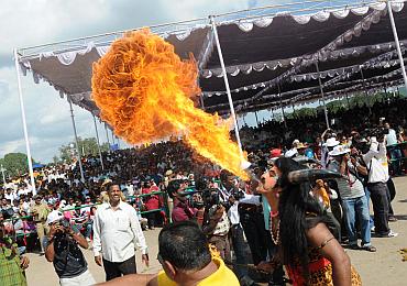 A fire eater performs at the Dusshera celebrations in Mysore
