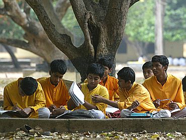 High school students sit under trees while they study in Shantiniketan