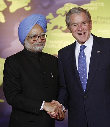 US President George Bush greets India's Prime Minister Manmohan Singh in Washington
