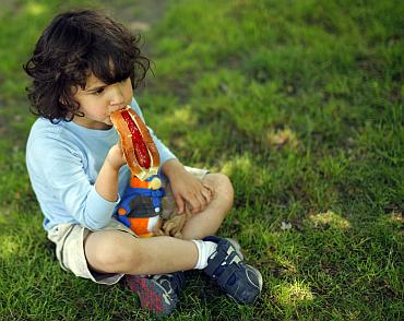 A child eats a hot dog in Providence, Rhode Island