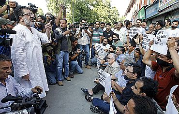 A senior journalist addresses protesting members of the Kashmir-based media in Srinagar