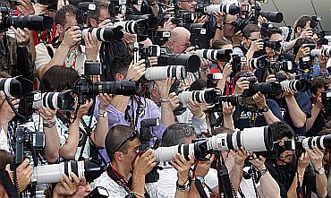 Photographers shoot with their cameras during a photocall at the Cannes Film Festival
