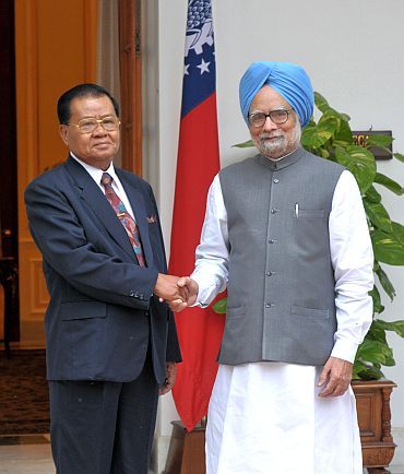 File photo shows Prime Minister Manmohan Singh with visiting Myanmar military ruler General Than Shwe