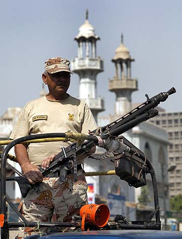 A Pakistani Ranger keeps guard in the streets of Karach