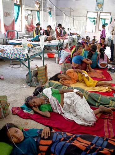 Patients, affected with malaria, crowd in a hospital ward in Naxalbari, West Bengal