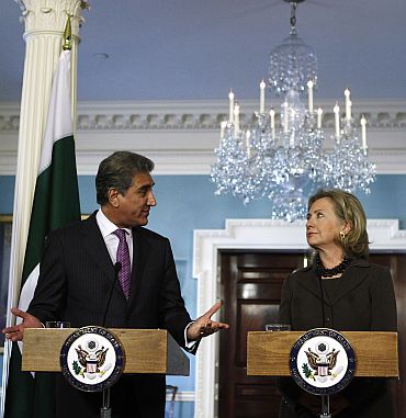 Pakistan Foreign Minister Shah Mahmood Qureshi speaks to US Secretary of State Hillary Clinton during a news conference after the US-Pakistan Strategic Dialogue Plenary Session at the State Department in Washington on October 22