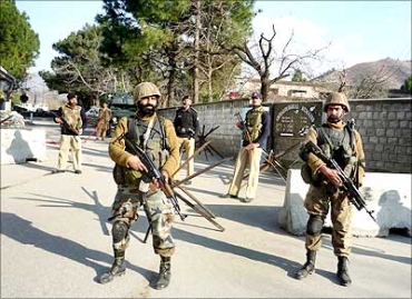 Pakistani soldiers guard a street in the Swat valley