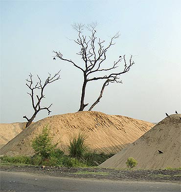 Mounds of dredged sand along the banks of the Ganga