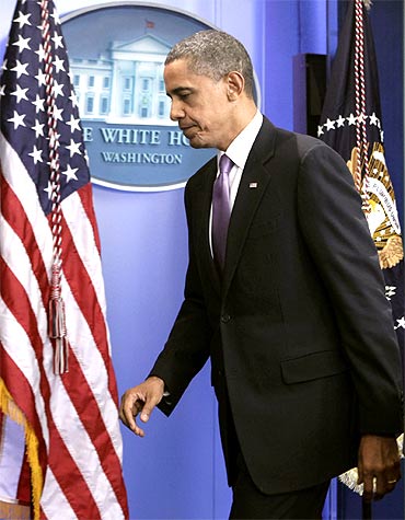US President Barack Obama leaves after making a statement at the White House