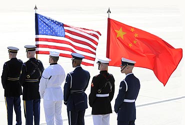 A colour guard of US and Chinese flags awaits President of China Hu Jintao's plane in Washington