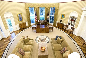 The redecorated Oval Office has new carpeting, wallpaper and sofas