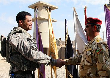US Army Cpt Victor Morris, F Co 5-2 Infantry Commander, meets with Lt Col Abdulah Jarih-Wohayed, 4226 Iraqi Army (IA) Battalion Commander at IA head quarters in Baghdad