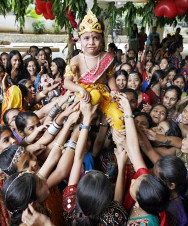 A boy dressed as Lord Krishna during Janmashtami celebrations