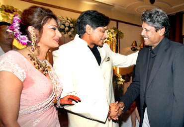 Former Team India captain Kapil Dev greets the newly wedded couple at a reception in New Delhi