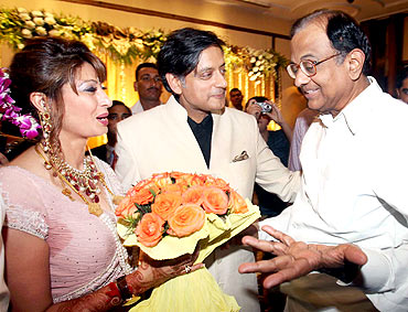 Union Home Minister P Chidambaram presents a bouquet of flowers to the newly wedded couple