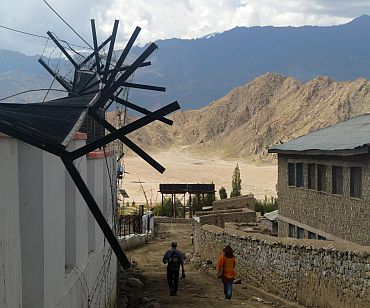 The fence outside the All India Radio station in Leh bent out of shape