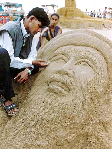 Patnaik adds the final touches to a sand sculpture of Osama bin Laden