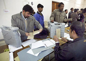 Election officials handover EVMs to the returning officer in Leh