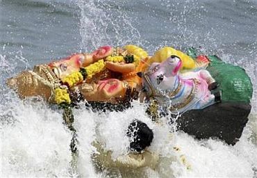 A Ganesh idol washes up on the Mumbai shoreline a day after it was immersed