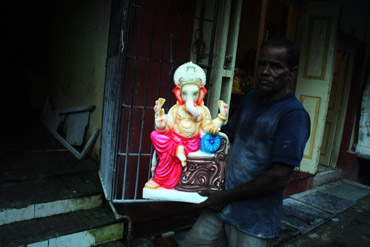 A finished Ganesha idol being taken to the warehouse