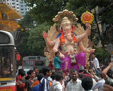 A Ganesha idol being taken in a procession
