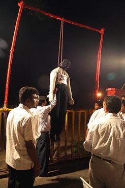 Protestors stage the mock hanging of a terrorist