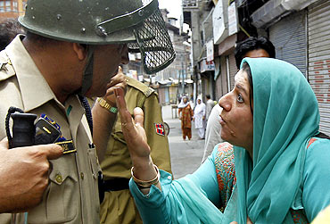 A Kashmiri woman confronts the police during protests in Srinagar