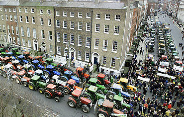 Irish farmers park their tractors in Merrion Square during a protest in Dublin