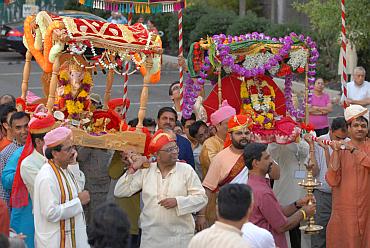 Devotees carry the Ganesh idols to the temple in Philadelphia