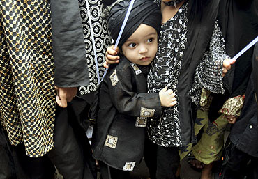 A child participates in a demonstration held in Mumbai
