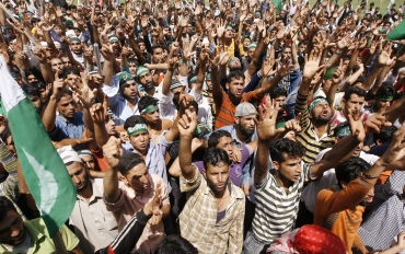Kashmiri protesters participate in an anti-India protest in Khonmuh, south of Srinagar
