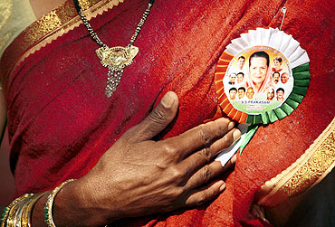 A Congress supporter wears a Sonia Gandhi tag