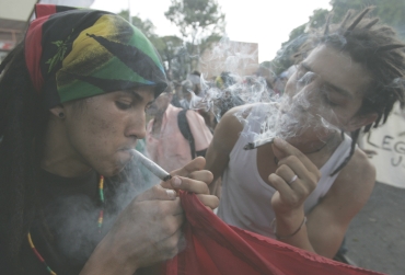 Protesters smoke marijuana during a demonstration in Medellin, Colombia