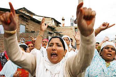 Women shout anti-India slogans during an anti-India protest in Srinagar
