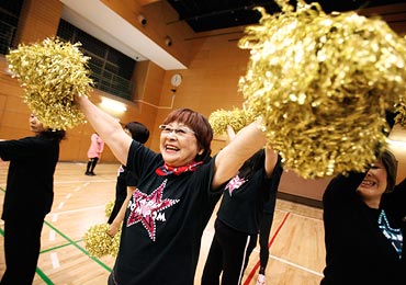 Fumie Takino, a 78-year-old cheerleader, practices cheerleading in Tokyo