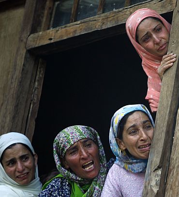 Relatives of a victim of police firing at his funeral in Kashmir