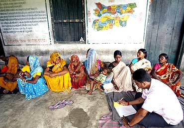 Pregnant women register their names as they wait for medical assistance in Araria district, Bihar