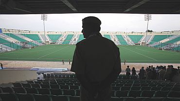 A policeman stands guard at the Major Dhyan Chand National Stadium in New Delhi