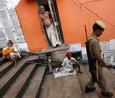 A policeman patrols outside a temple in Ayodhya