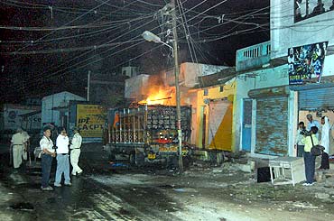Mediapersons at the site where a truck was torched in Danipura, September 3