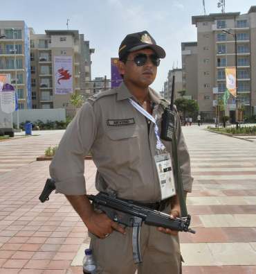 A security personnel at the Games Village