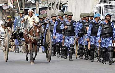 Security personnel patrol the streets of Ayodhya