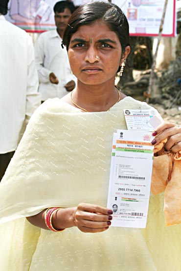 Mali Bhuri Rohidas shows her card